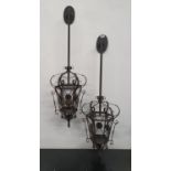 A pair of Metal wall mounted Hanging Lanterns.110h cms.