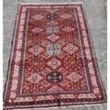 A full pile red ground Caucasian Carpet. 290cms x 192cms