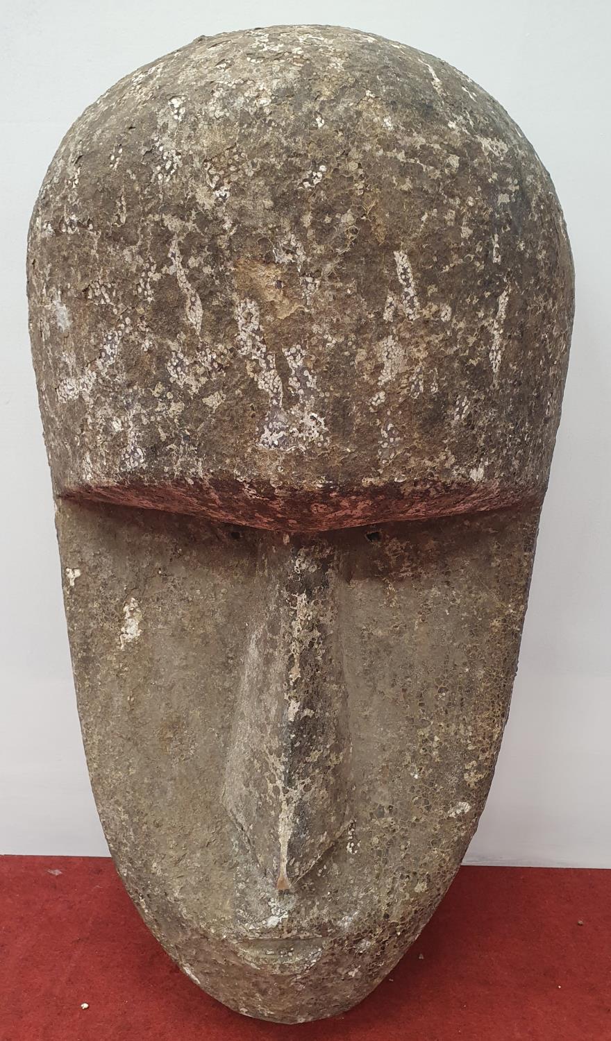 A wall mounted Stone style Head.