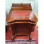 A Mahogany Davenport with red leather tooled inset.55w x 54d x 90h cms.