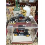 A battery operated Model of Vintage cars. one cased along with a Locks Irish Whiskey and Tullamore