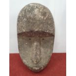 A wall mounted Stone style Head.