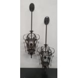 A pair of Metal wall mounted Hanging Lanterns.110h cms.