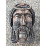 A large Timber Carving of an Indian Chief with large ring handle.