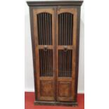 A lovely Timber two door Cabinet with grilled doors.86w x 38d x 196h cms.