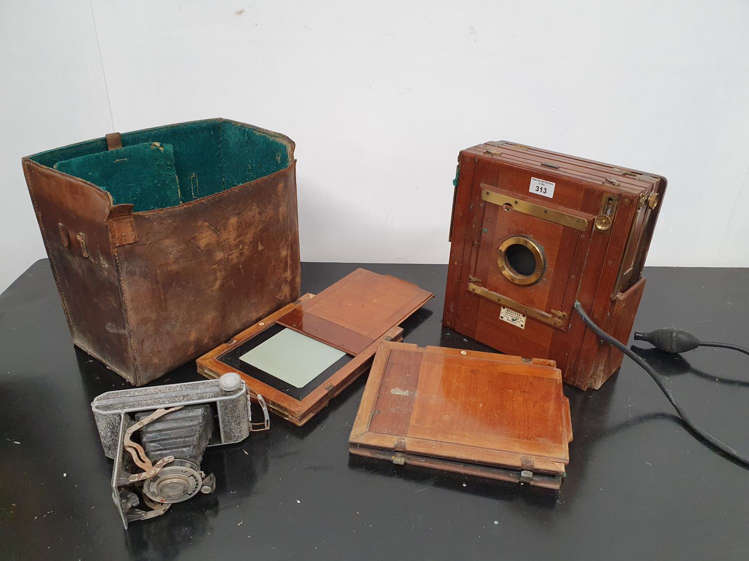 A 19th Century Mahogany Camera by Meagher, London along with a small camera.25w cms.