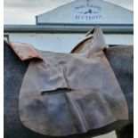 Ten Leather Saddle Covers.