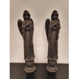 A pair of Ebonised Angels.