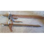 A group of nine prop swords and Scabbards.