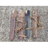 A group of four Leather Quivers each with Arrows.