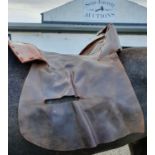 Ten Leather Saddle Covers.