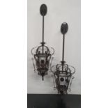 A pair of Metal wall mounted Hanging Lanterns.110h cms.