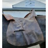 Ten Leather Saddle Covers.