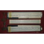 Three vintage Draughtsman's Rulers along with two vintage railway keys.