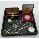 INTERESTING ITEMS LOT INCLUDING WATCHES BROOCHES COMMEMORATIVE COIN