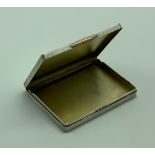 A 1933 GOLDSMITH & SILVERSMITH SOLID SILVER WITH GOLD CARD CASE