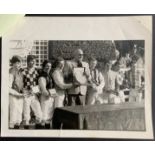 TELLY SAVALAS (TV COP KOJAK) PHOTO WITH USA & UK JOCKEYS CHALLENGE TEAMS 1983