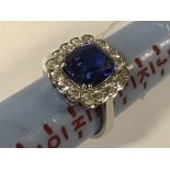 18CT WHITE GOLD WITH 16 DIAMOND SURROUND & A TANZANITE TO CENTRE OF APPROX 5.31CTS TOTAL DIAMONDS IS