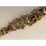 VINTAGE 18CT GOLD DIAMOND & RUBY ENCRUSTED COCKTAIL WATCH