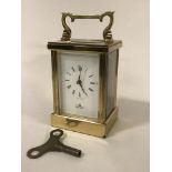 AN IMPERIAL 8 DAY BRASS CARRIAGE CLOCK & KEY