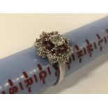 18CT WHITE GOLD DIAMOND & RUBY RING - CENTRE DIAMOND APPROX 0.50CT