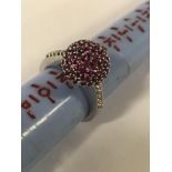 18CT WHITE GOLD DIAMOND & RUBY CLUSTER RING