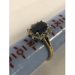 18CT GOLD DIAMOND & CENTRE SAPPHIRE RING