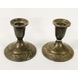 PAIR OF SILVER EMBOSSED CANDLESTICKS