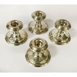 FOUR STERLING SILVER CANDLESTICKS