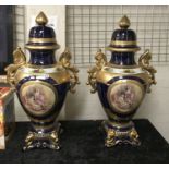 PAIR OF CLASSICAL URNS WITH LIDS