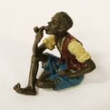 PAINTED BRONZE SEATED ARAB BOY