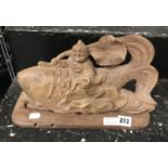 CARVED WOODEN SCULPTURE ON BASE OF MAN & FISH