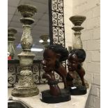 PAIR OF CARVED ETHNIC BUSTS WITH A PAIR OF CANDLESTICKS