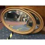 TWO OVAL MIRRORS