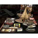 COLLECTION OF BOXED MODEL CARS, BATTLE SHIPS & MODEL YACHTS