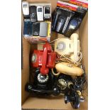 1960's/70's telephones together with production telephones, mobile phone, Pifco red dome torch