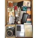 A box of miscellaneous collectibles including hip flasks, cigarette boxes, photo frames, watch, card