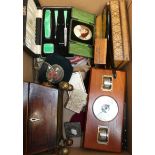 Two cased vanity sets, decorative boxes, a wall barometer, a mahogany sarcophagus, a box on raised