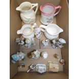 A collection of ceramic figures, Masons ivory water jug together with three other water jugs