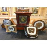 Three oak and mahogany and faced mantle clocks together with a Junghans wall clock, and a Smiths