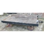 A vintage railway luggage trailer, with painted wooden decking to cast iron wheels, 225 x 135cm.