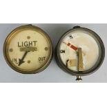 A Light In/Out gauge, diameter 10cm, together with another gauge marked 'On Wrong Off', lacking