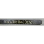 A painted wood direction sign 'Doncaster, Kings Cross, etc.', 12 x 107cm.