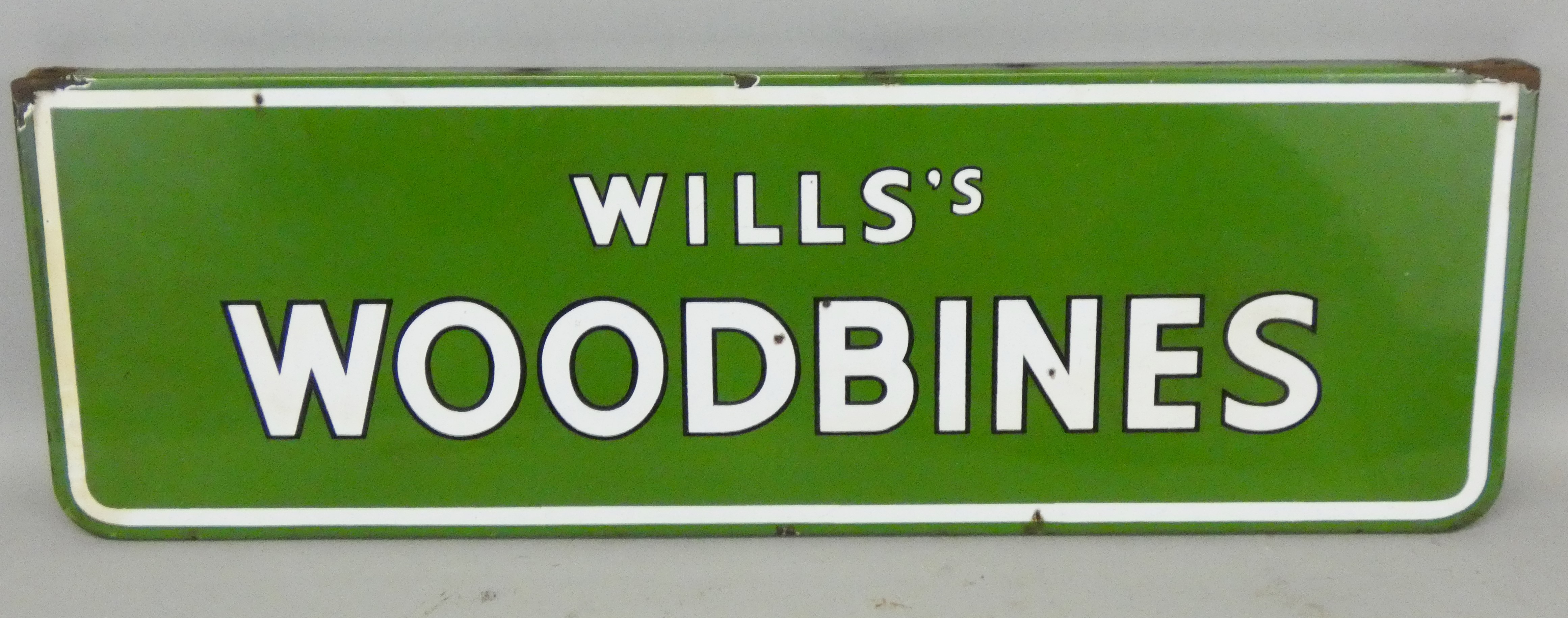 A vintage rectangular single sided enamel ceiling mounted sign for Wills's Woodbines, 23 x 71.5cm.