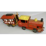 A Tri-ang tinplate red painted childs train, No. 73000, length 47cm, together with a matchstick