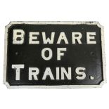A cast iron 'Beware of Trains.' sign, 51 x 34 cm.
