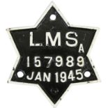 A wagon plate 'LMS A 157989 Jan 1945', star shape, 16 x 18 cm.