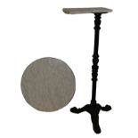 A circular marble topped cast iron table, with plastic replacement tabletop (AF), diameter 60cm,