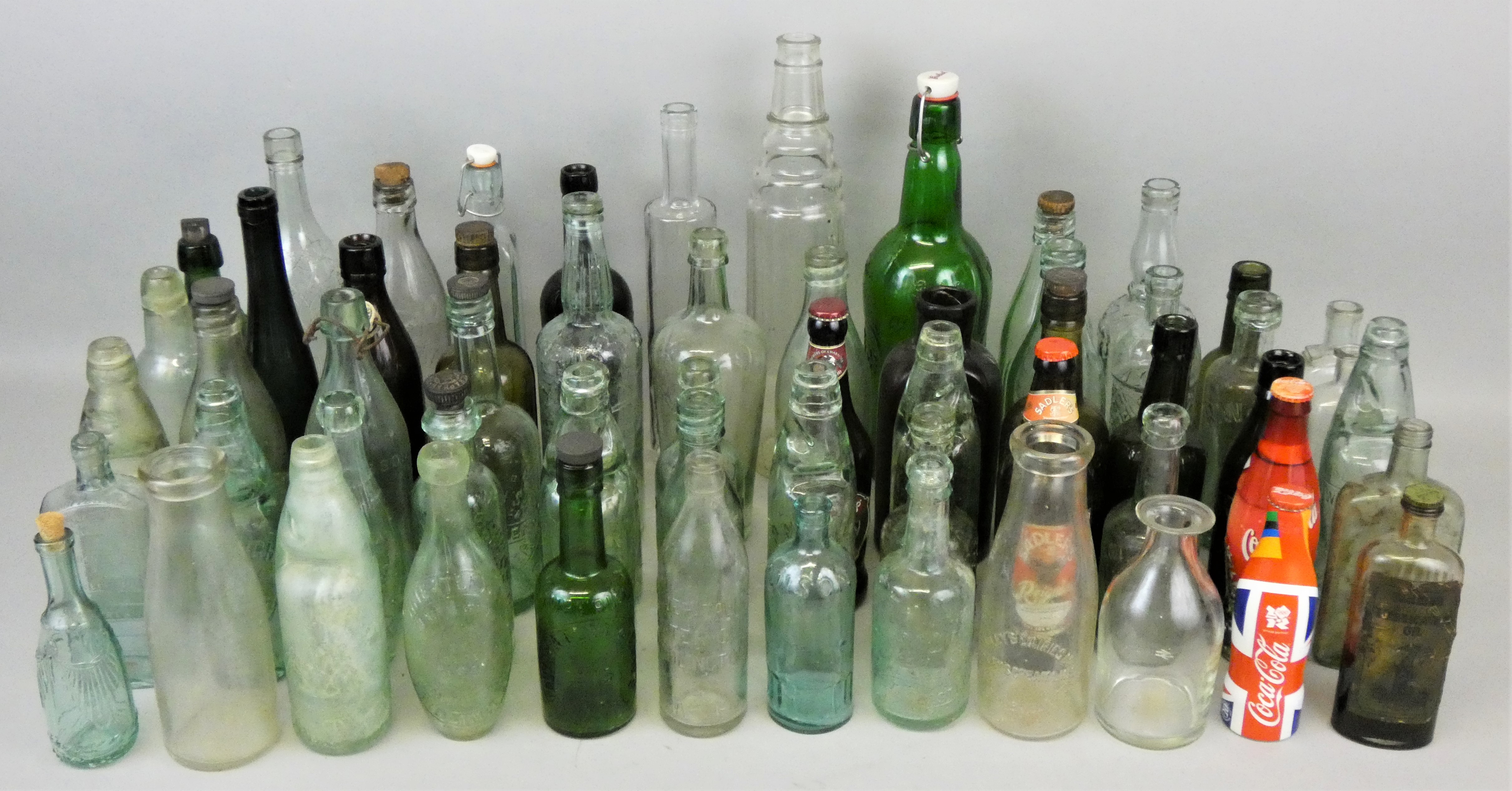 Three boxes of vintage glass bottles, including W. Peacock, Scarborough, J. H. Rymer, Hull and J.