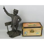 A resin figure of a North Eastern Railway conductor by a York signpost, height 47cm together with